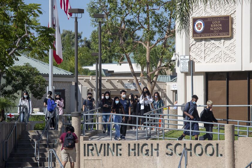 IRVINE, CA - SEPTEMBER 24: Irvine High School students exit their classrooms on the first day of returning back to school since the coronavirus pandemic began at Irvine High School on Thursday, Sept. 24, 2020 in Irvine, CA. (Allen J. Schaben / Los Angeles Times)