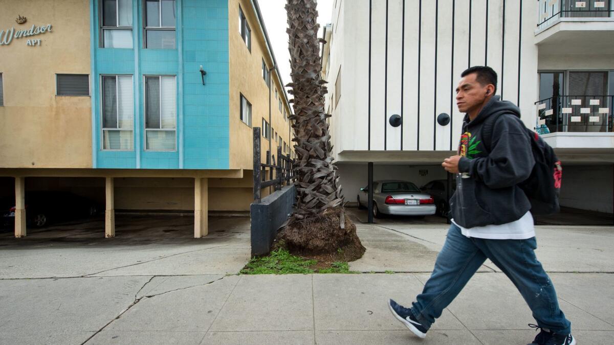 Some wood apartments' ground-floor carports are held up by flimsy columns that might collapse in a quake. The city has tallied 1,728 possible "soft-story" apartments. (Michael Owen Baker / For The Times)