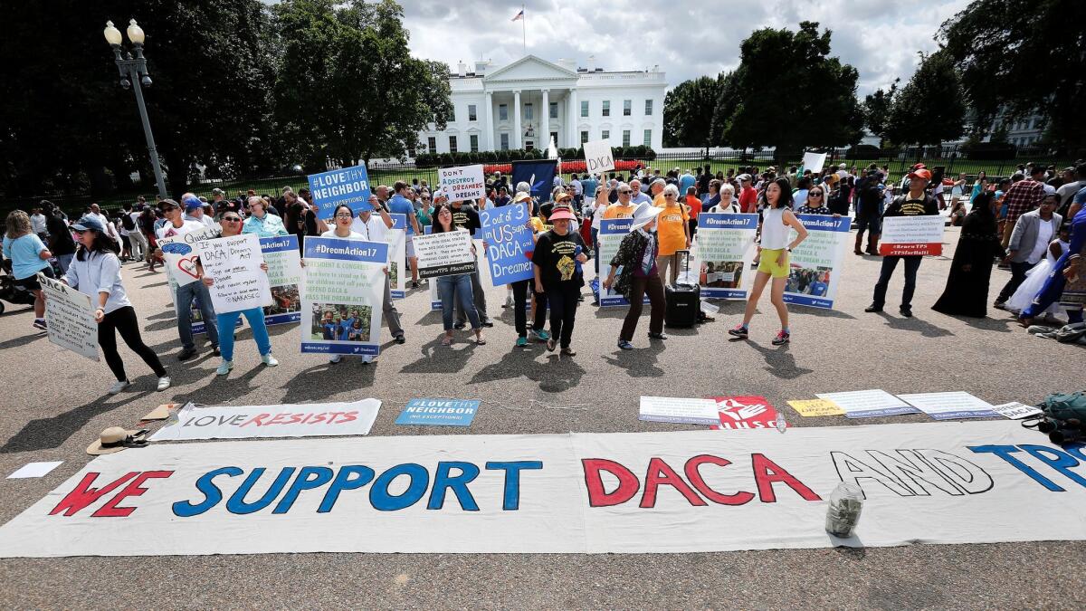 Supporters of the Deferred Action for Childhood Arrivals program demonstrate outside the White House on Sunday.