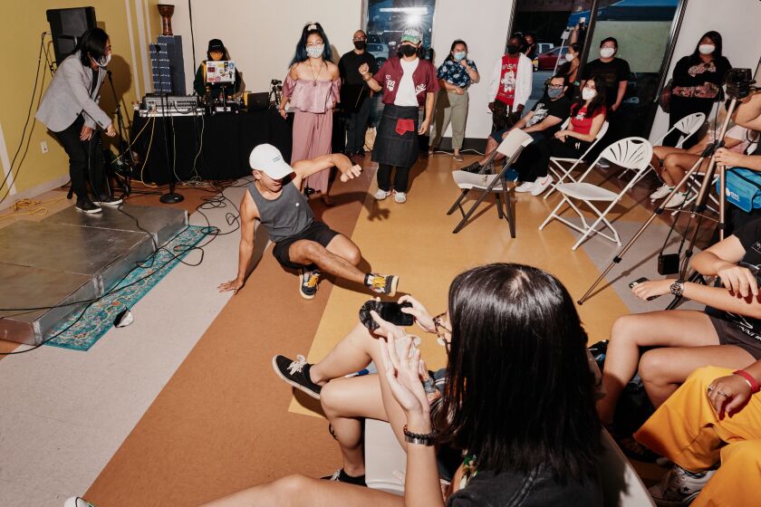 Los Angeles, CA - 9/05/21: Impromptu dancing breaks out the end of the Sunday Jump event inside the Pilipino Workers Center. Sunday, Sept. 5, 2021 in Historic Filipinotown. (PHOTOGRAPH BY ADAM AMENGUAL / FOR THE TIMES)