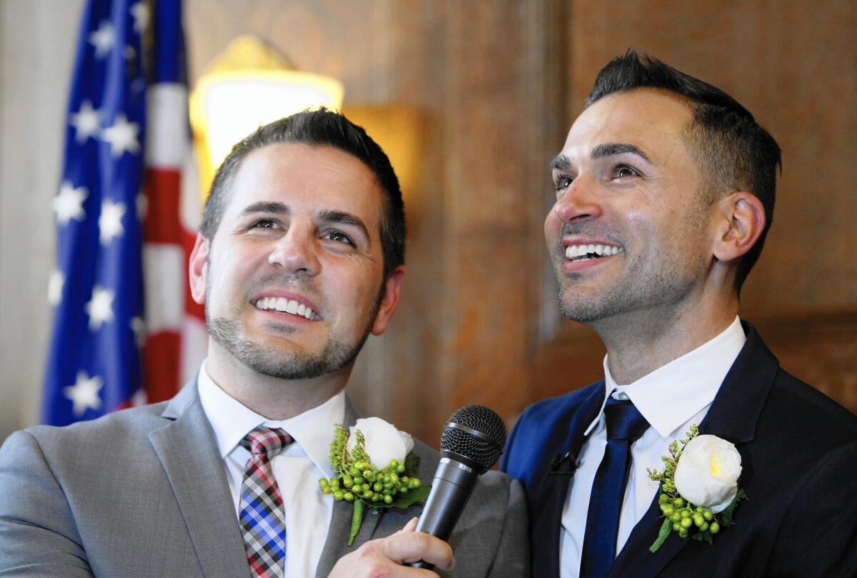Jeff Zarrillo, left, and his partner Paul Katami speak to the media after a wedding ceremony officiated by then-Los Angeles Mayor Antonio Villaraigosa at Los Angeles City Hall on June 28, 2013. The pair brought their case against Proposition 8 to the United States Supreme Court.