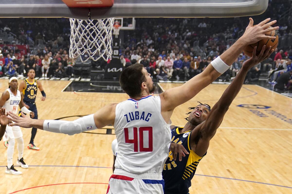 Clippers center Ivica Zubac blocks the shot of Indiana Pacers guard Buddy Hield.