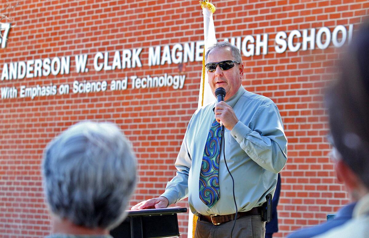 Clark Magnet High School Principal Doug Dall at a bench dedication for Barbara Melone at Clark Magnet High School in Arpil 2014.