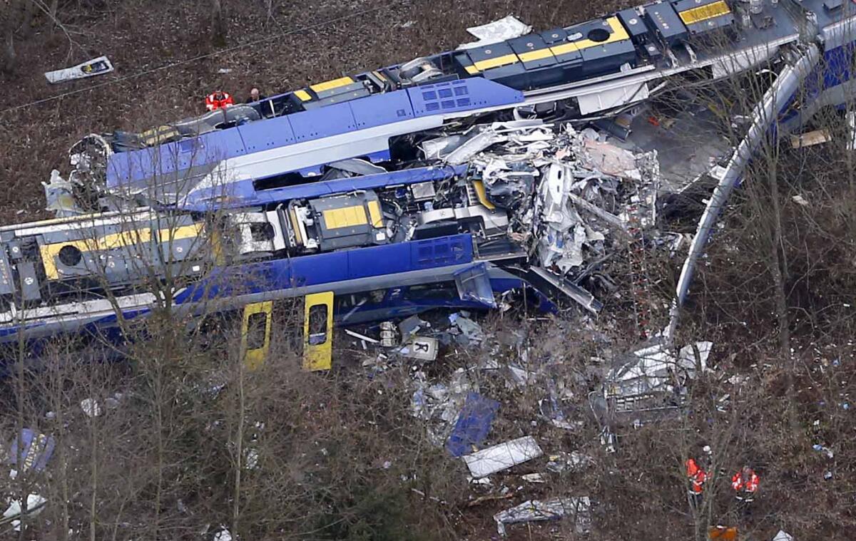 Rescue teams work at the site where two trains collided head-on near Bad Aibling, Germany, on Feb. 9.