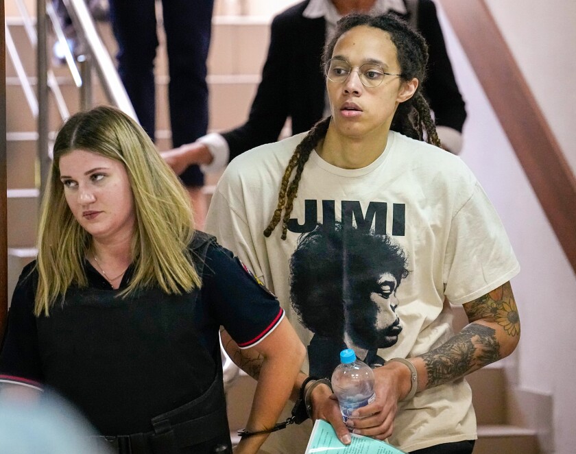 WNBA star and two-time Olympic gold medalist Brittney Griner is escorted to a courtroom in Moscow.