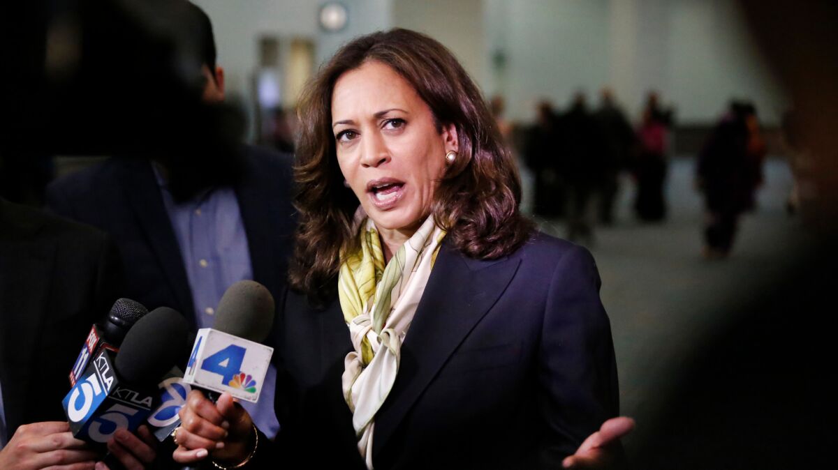 California Atty. Gen. Kamala D. Harris speaks to reporters this week. On Friday, her office announced a settlement with a charter school operator the state accused of false advertising, among other allegations.