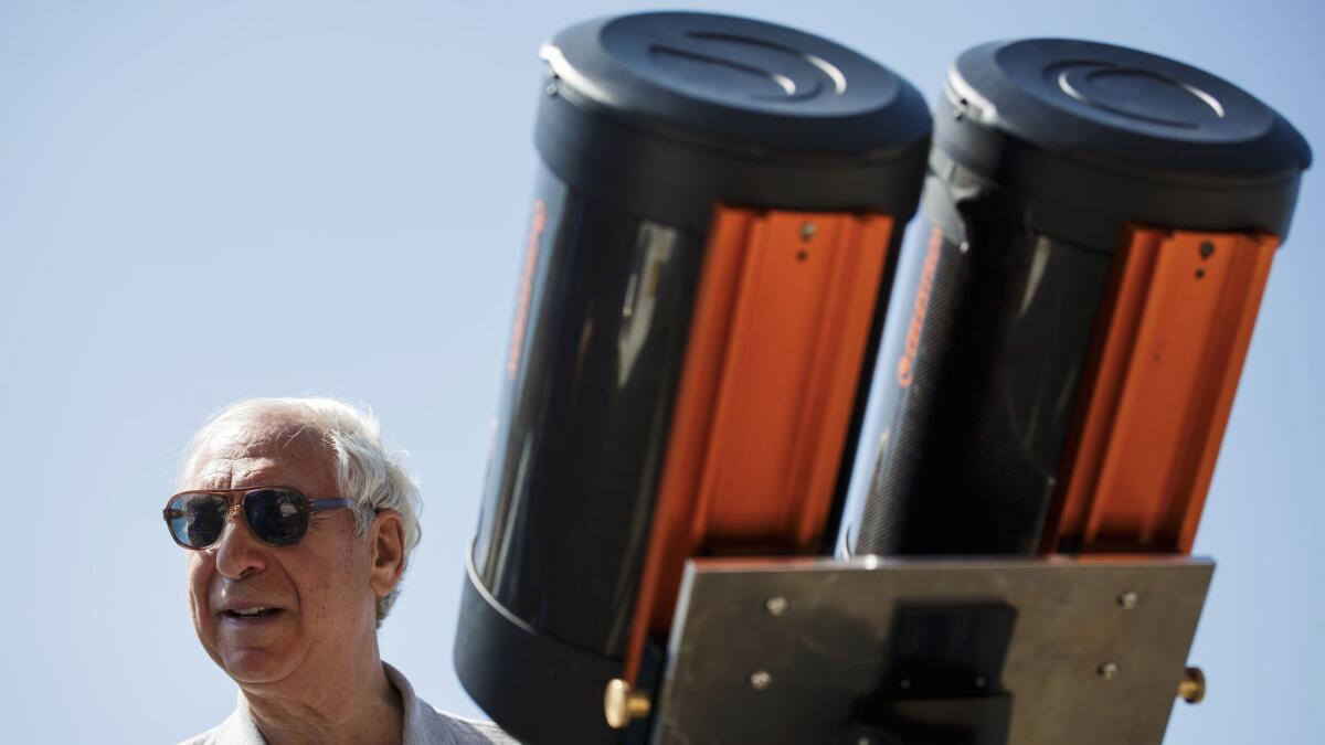 Jay Pasachoff supervises a large telescope being set up to observe the solar eclipse at Willamette University in Oregon.