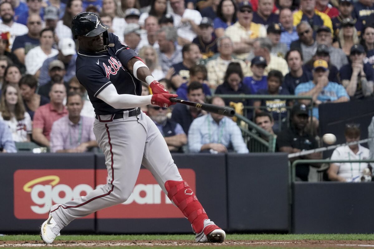 Atlanta Braves' Jorge Soler doubles against the Milwaukee Brewers during the third inning in Game 2 of baseball's National League Divisional Series Saturday, Oct. 9, 2021, in Milwaukee. (AP Photo/Morry Gash)