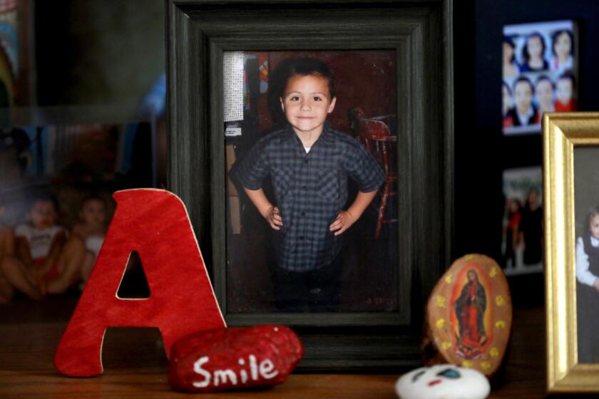 CALIFORNIA CITY, CALIF. -- FRIDAY, AUGUST 2, 2019: A photo of Anthony Avalos, taken in 2013 at the age of six-years-old, at the home of David and Maria Barron in California City, Calif., on Aug. 2, 2019. The Barrons are the aunt and uncle of Anthony Avalos. Between February, 2013, and November, 2016, the county’s child abuse hotline received at least 13 calls related to Anthony Avalos, a 10 year-old Lancaster boy. Then, on June 20, 2018 he was found unresponsive in his family's apartment. He died the next day, June 21, 2018. (Gary Coronado / Los Angeles Times)