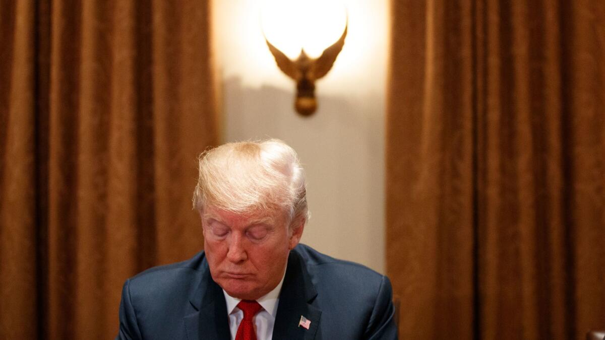 President Trump listens during a meeting with law enforcement officials in Washington on Feb. 6.