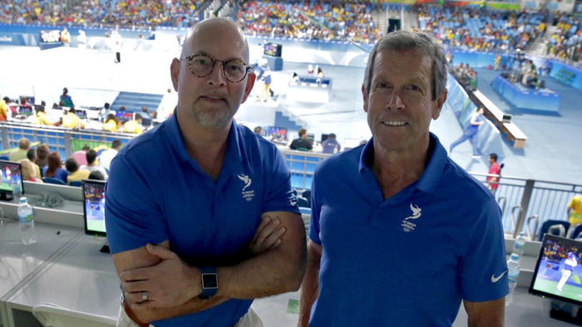 Bill Hanway, left and Doug Arnot work behind the scenes at the Rio Olympics to try to deliver the Summer Games to L.A. in 2024.