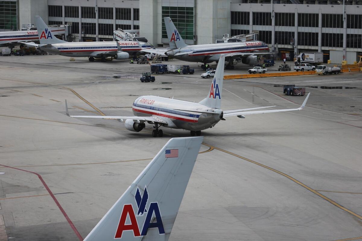 American Airlines and US Airways are pushing for an earlier trial date, in November, in their fight with the Justice Department.