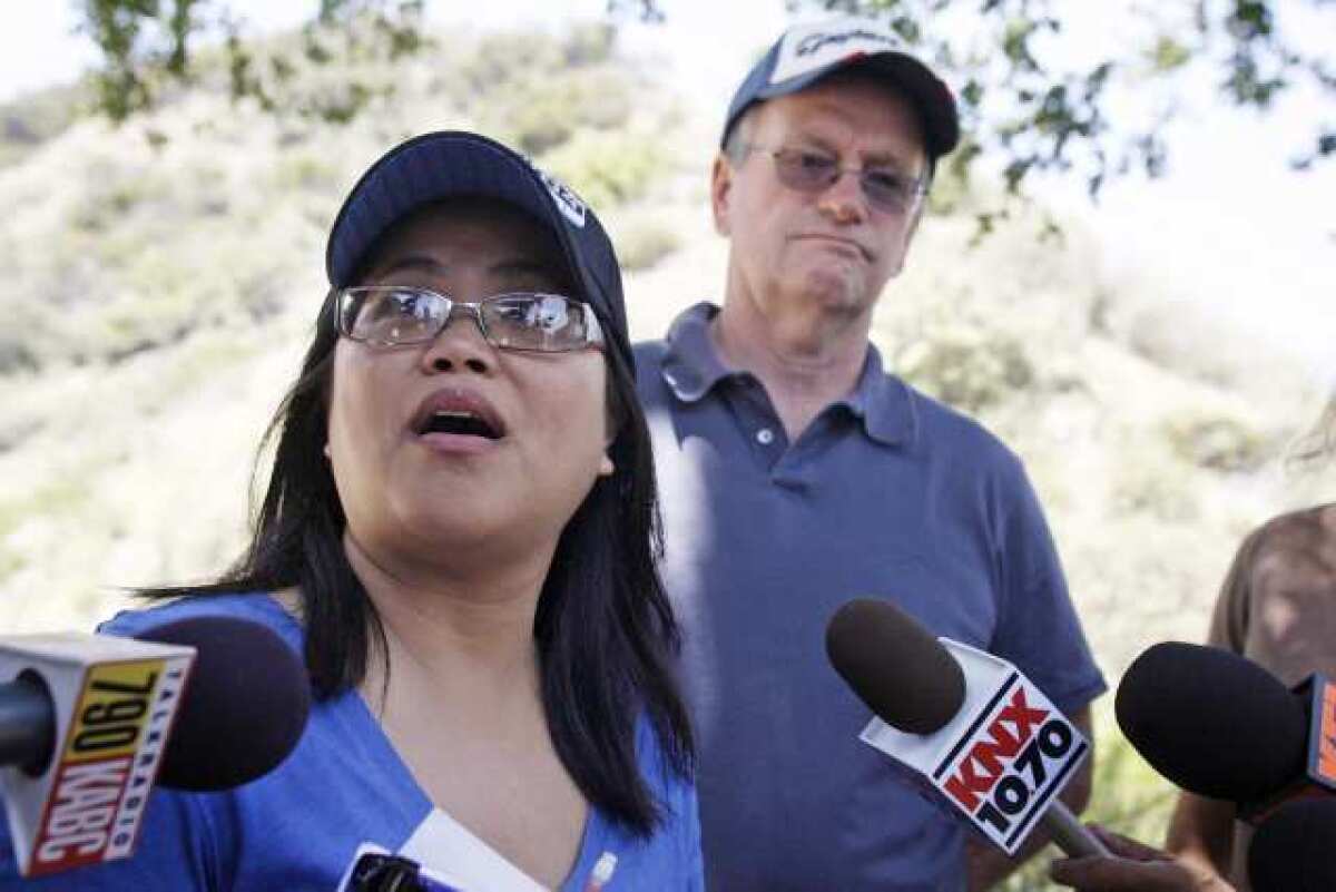 Thea Ivens asks for volunteers to help search for her missing husband, Stephen Ivens, during a press conference near the Stough Canyon Trail in Burbank.