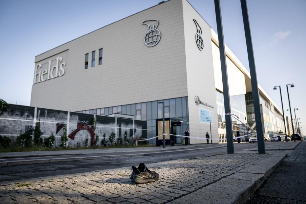 Abandoned tennis shoe outside Copenhagen shopping mall