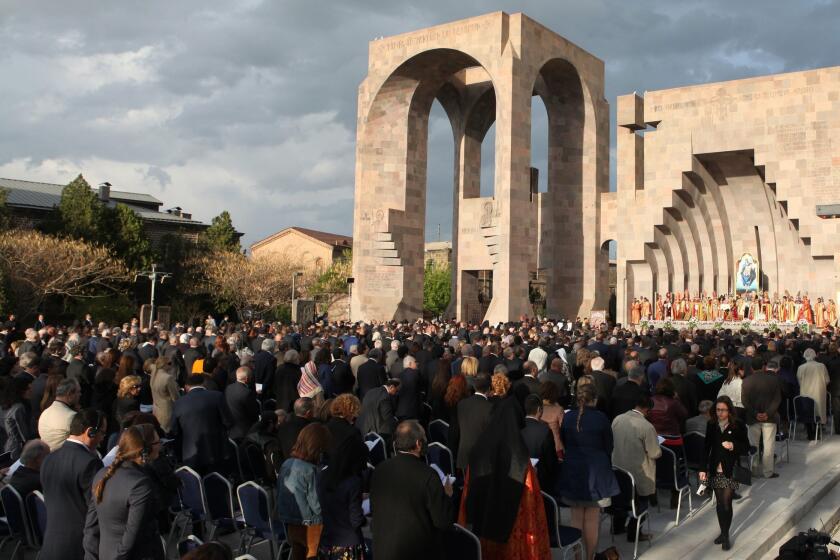 People attend a canonization ceremony for the victims of the Armenian Genocide at the Mother See of Holy Etchmiadzin complex outside Yerevan, Armenia, on April 23.