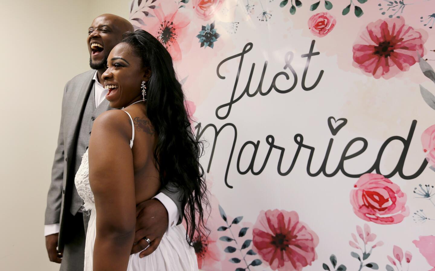 Jerry and Stephine Tyler pose for pictures following their Valentine's Day wedding at the L.A. County Registrar's office in Norwalk.