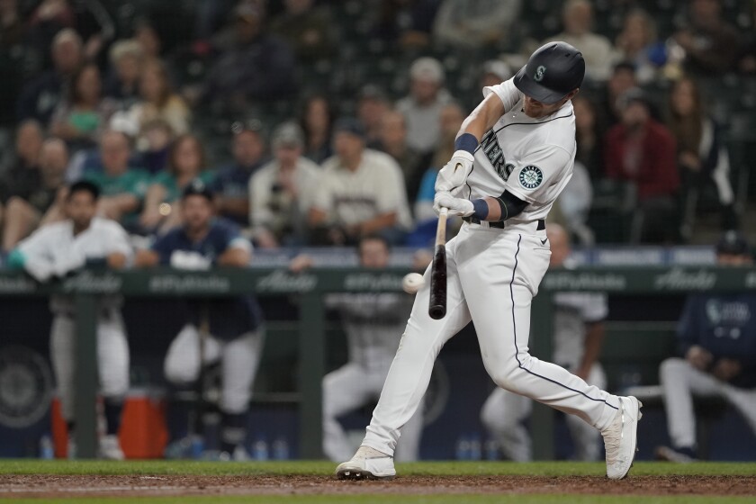Seattle Mariners' Jake Bauers hits a go-ahead solo home run against the Minnesota Twins during the eighth inning of a baseball game, Monday, June 14, 2021, in Seattle. (AP Photo/Ted S. Warren)