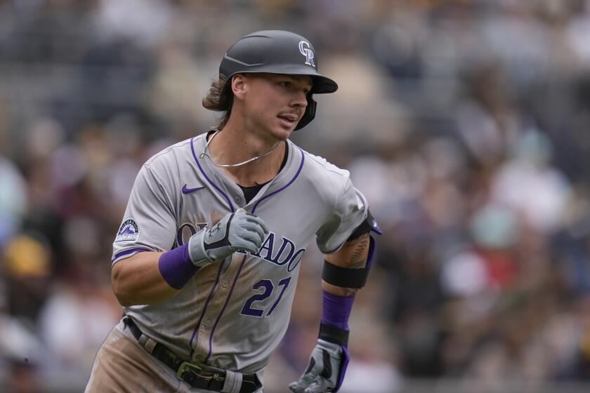 Colorado Rockies' Jordan Beck runs to first base after hitting an RBI single during the eighth inning of a baseball game against the San Diego Padres, Wednesday, May 15, 2024, in San Diego. (AP Photo/Gregory Bull)