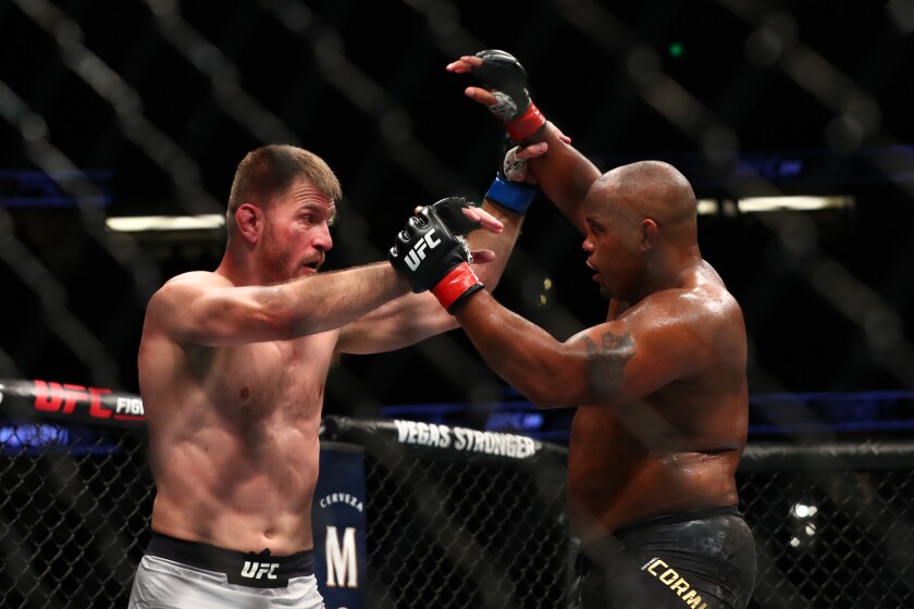 Daniel Cormier throws a punch at Stipe Miocic in the second round during their UFC Heavyweight Title Bout at UFC 241 at Honda Center on Saturday.