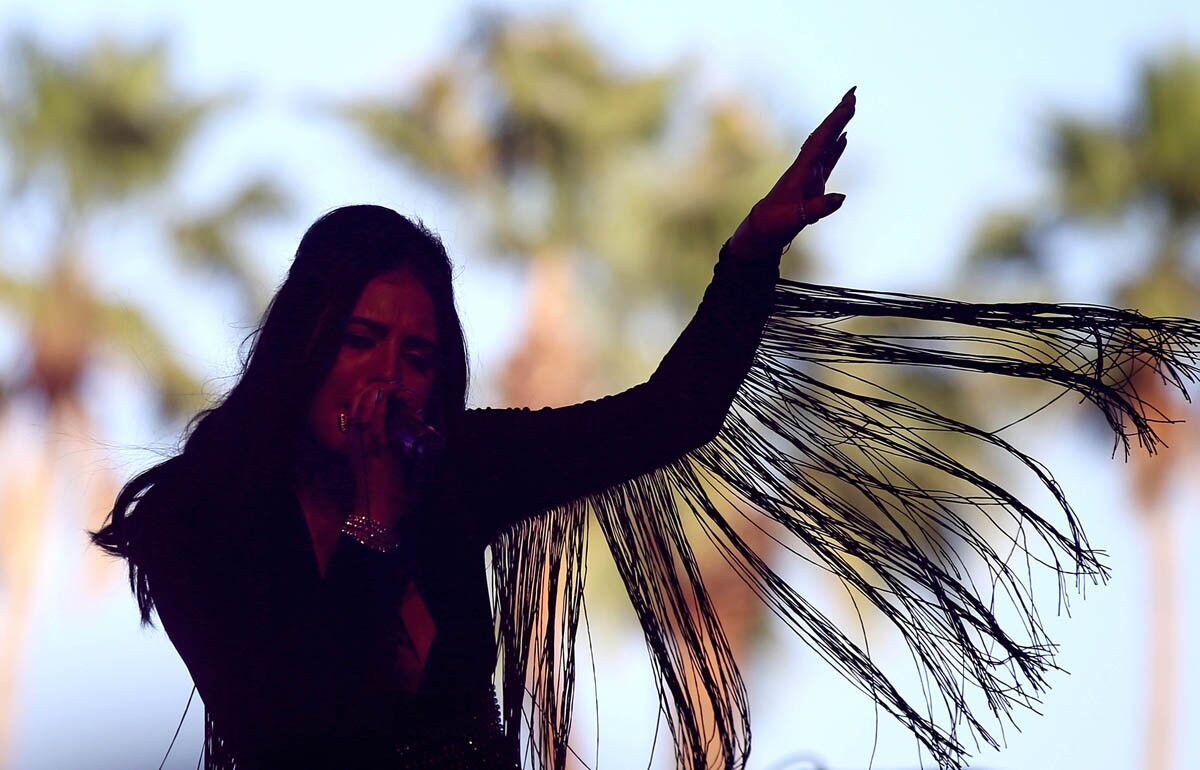 INDIO, CALIF. - APRIL 15, 2017. Queen Starlie Cheyenne, lead singer of the Atomics, performs on the Gobi Stage on day two of the Coachella Music and Arts Festival in Indio on Saturday, April 15, 2017. (Luis Sinco/Los Angeles Times)