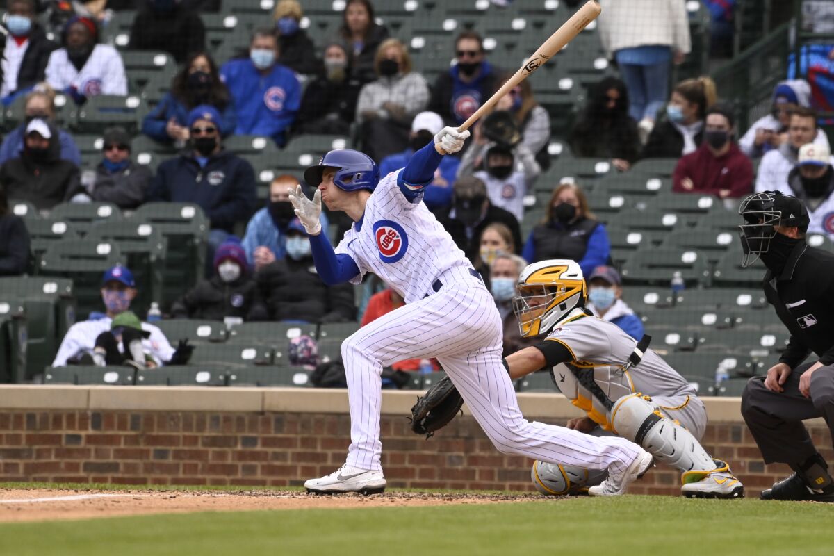 Chicago Cubs' Matt Duffy (5) hits an RBI single during the seventh inning of a baseball game against the Pittsburgh Pirates, Saturday, May 8, 2021, in Chicago. (AP Photo/Matt Marton)