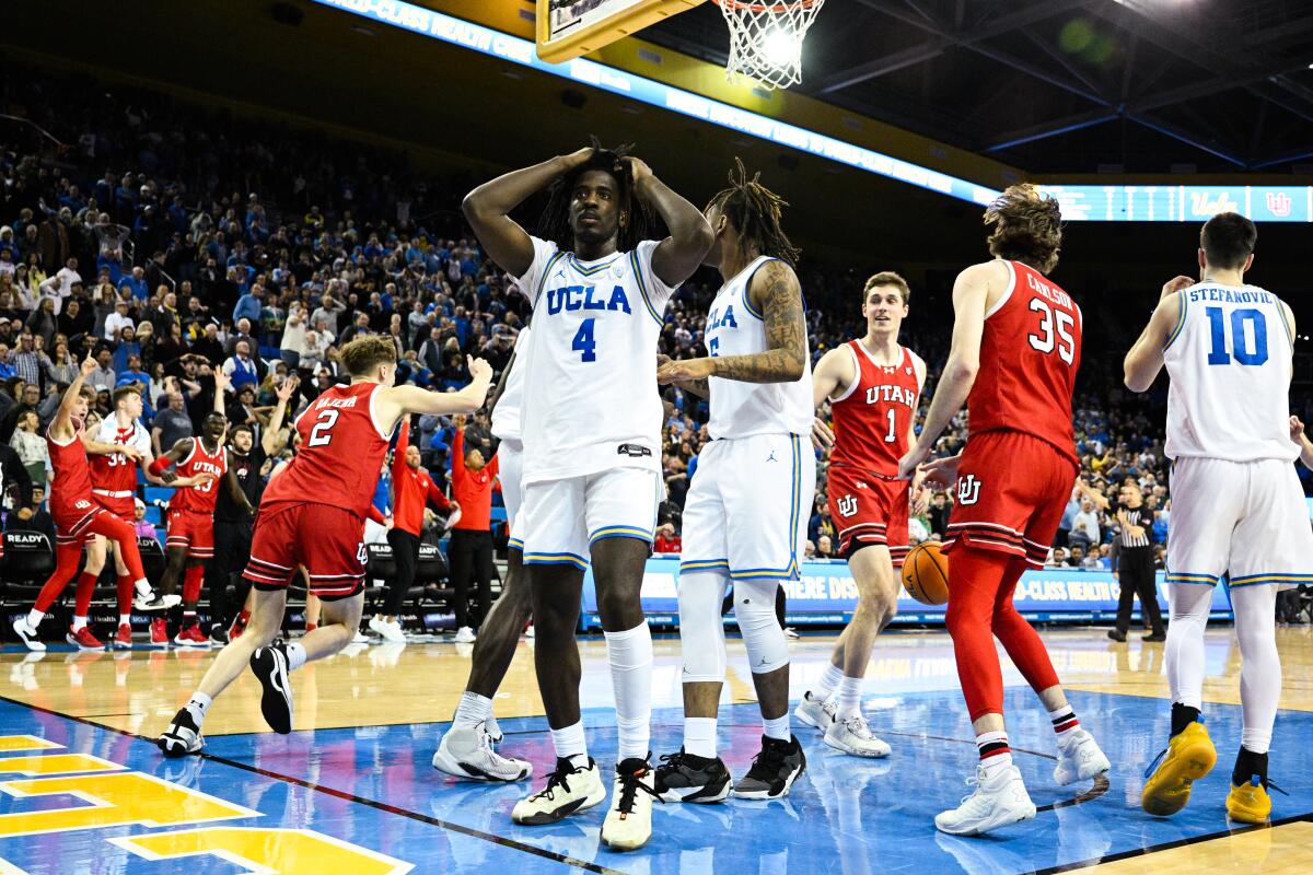 UCLA guard Will McClendon reacts after Utah center Branden Carlson scores with less than a second remaining.