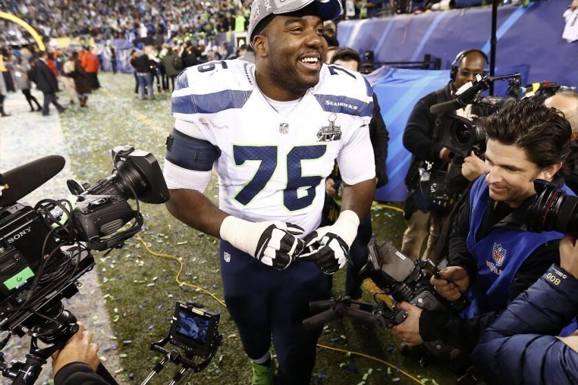 Seattle Seahawks tackle Russell Okung celebrates after the Seattle Seahawks defeated the Denver Broncos to win Super Bowl XLVIII Sunday. The game, telecast on Fox, drew record ratings.