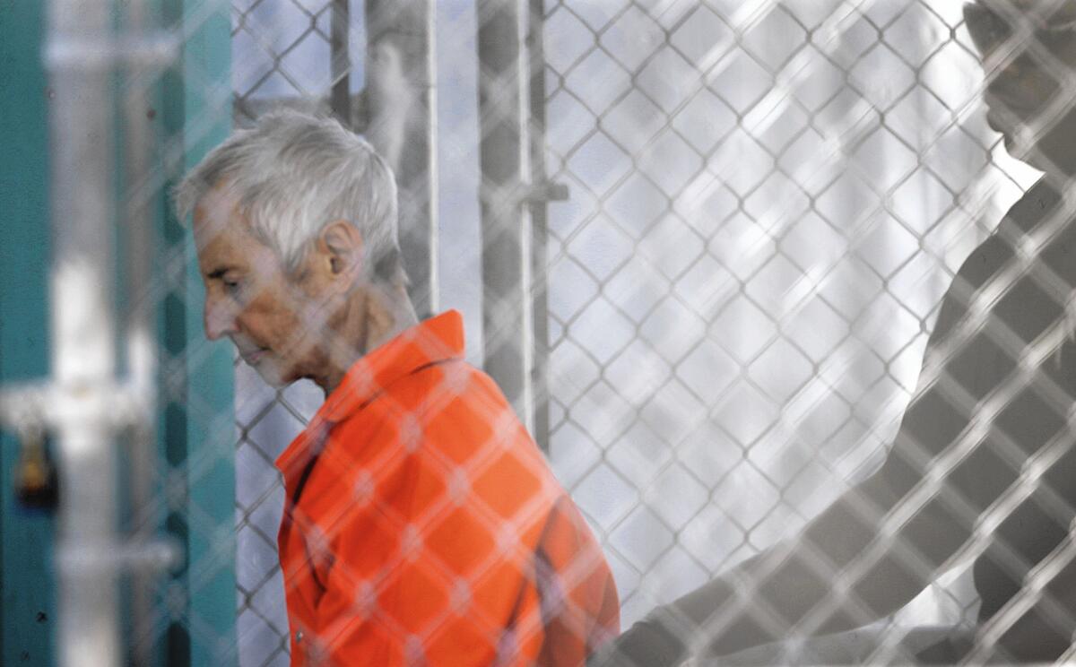 Robert Durst is escorted into Orleans Parish Prison after his arraignment in Orleans Parish Criminal District Court in New Orleans.