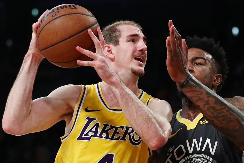 LOS ANGELES, CALIFORNIA - APRIL 04: Alex Caruso #4 of the Los Angeles Lakers drives to the basket against Jordan Bell #2 of the Golden State Warriors during the second half at Staples Center on April 04, 2019 in Los Angeles, California. NOTE TO USER: User expressly acknowledges and agrees that, by downloading and or using this photograph, User is consenting to the terms and conditions of the Getty Images License Agreement. (Photo by Yong Teck Lim/Getty Images)