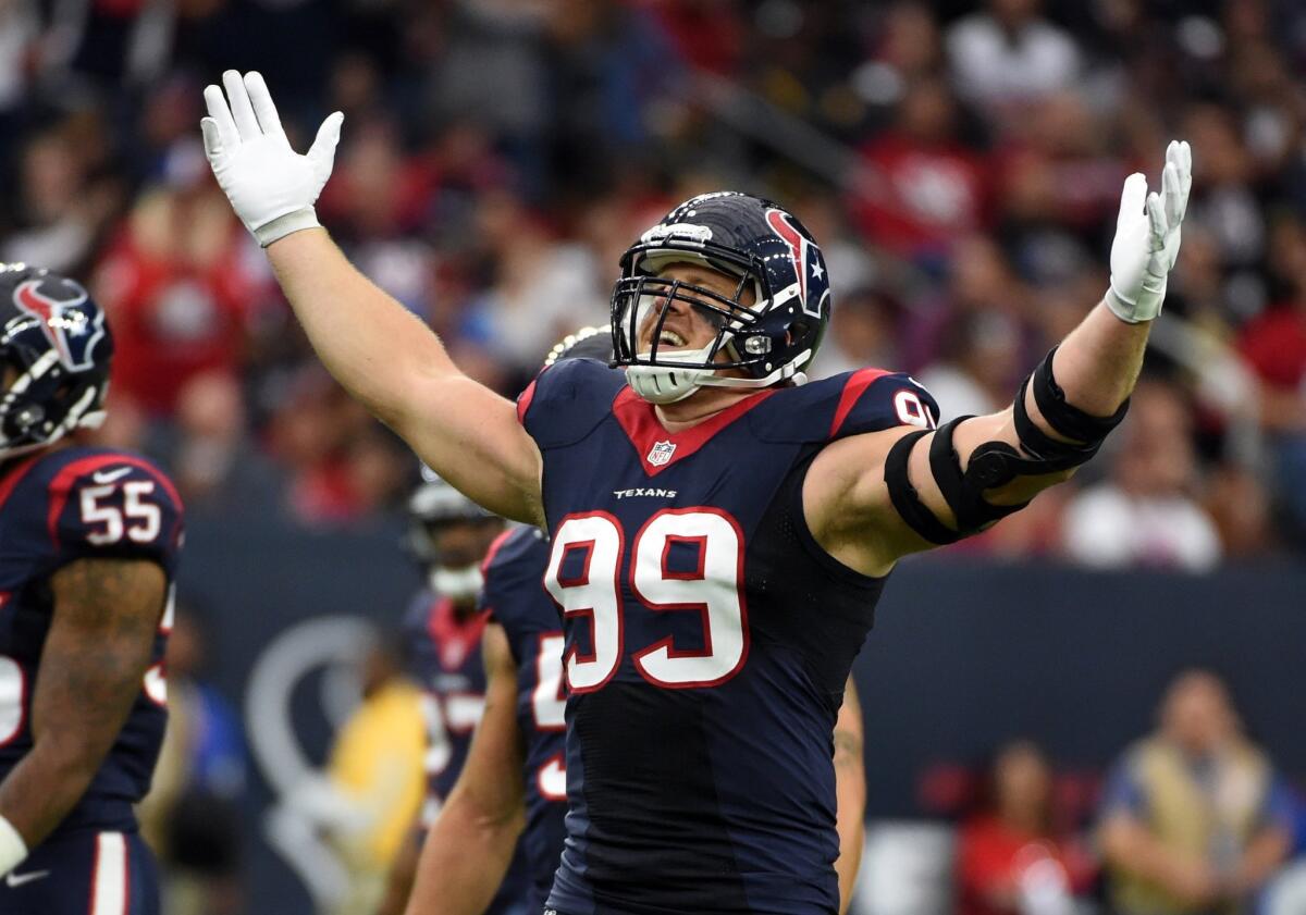 Houston Texans defensive end J.J. Watt motions to the crowd during a game against New Orleans.