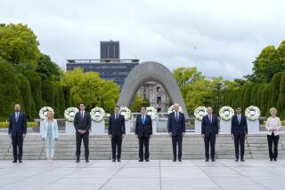 President Joe Biden, fourth right, and other G7 leaders pose for a photo during a visit to the Hiroshima Peace Memorial Park in Hiroshima, Japan, Friday, May 19, 2023, during the G7 Summit. Pictured from left: President Charles Michel of the European Council, Prime Minister Giorgia Meloni of Italy, Prime Minister Justin Trudeau of Canada, President Emmanuel Macron of France, Prime Minister Fumio Kishida of Japan, U.S. President Joe Biden, Chancellor Olaf Scholz of Germany, Prime Minister Rishi Sunak of the United Kingdom and President Ursula von der Leyen of the European Commission.(AP Photo/Susan Walsh, Pool)