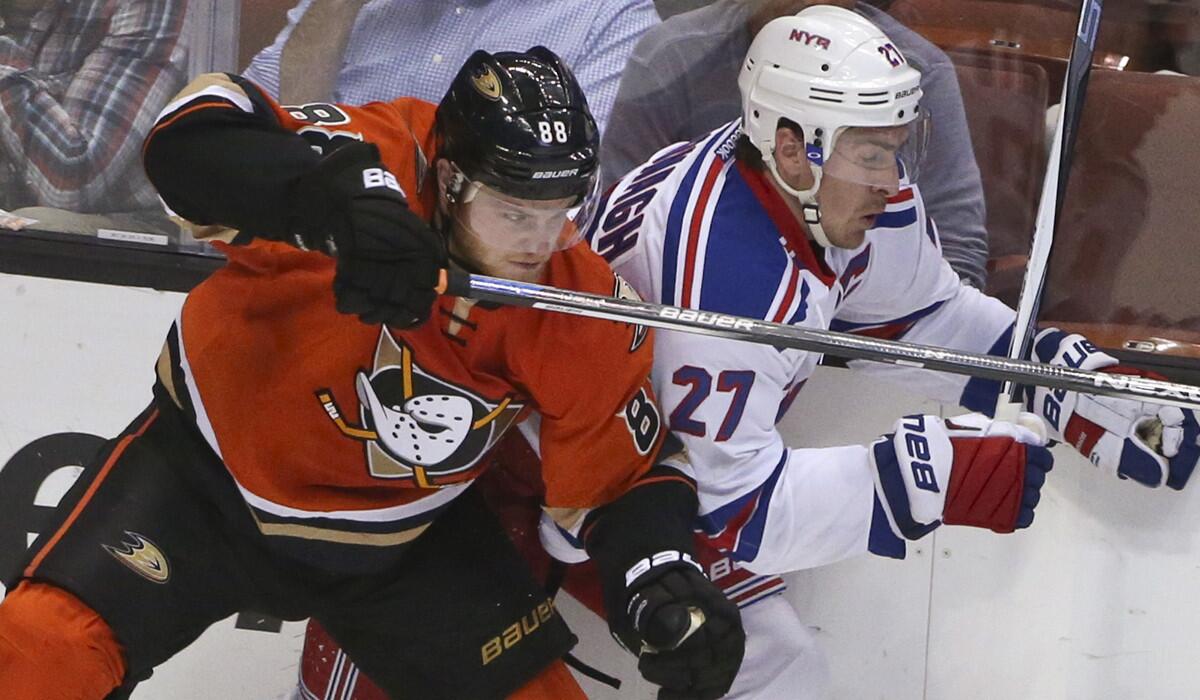 Anaheim Ducks left wing Jamie McGinn slams a check into New York Rangers defenseman Ryan McDonagh during the second period on Wednesday.