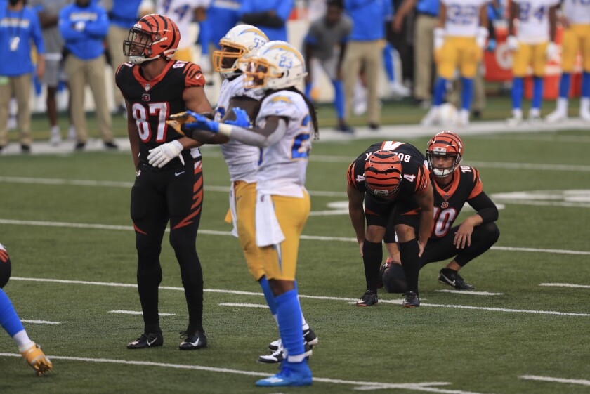 Cincinnati Bengals kicker Randy Bullock (4) reacts after missing a game tying field goal during the second half of an NFL football game against the Los Angeles Chargers, Sunday, Sept. 13, 2020, in Cincinnati. Los Angeles won 16-13. (AP Photo/Aaron Doster)