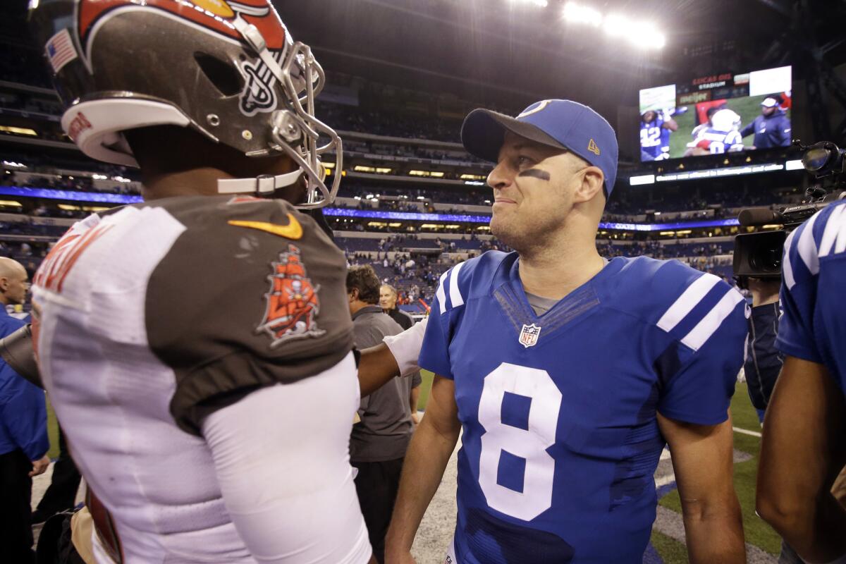 Colts quarterback Matt Hasselbeck (8) greets Buccaneers quarterback Jameis Winston following Indianapolis' 25-12 win on Sunday.