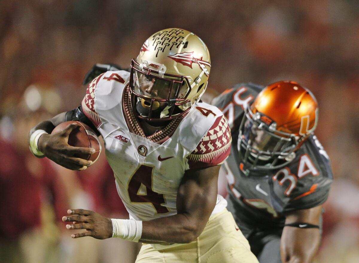 Florida State running back Dalvin Cook has been suspended indefinitely by the team after being charged with misdemeanor battery following allegations that he hit a woman outside a bar.