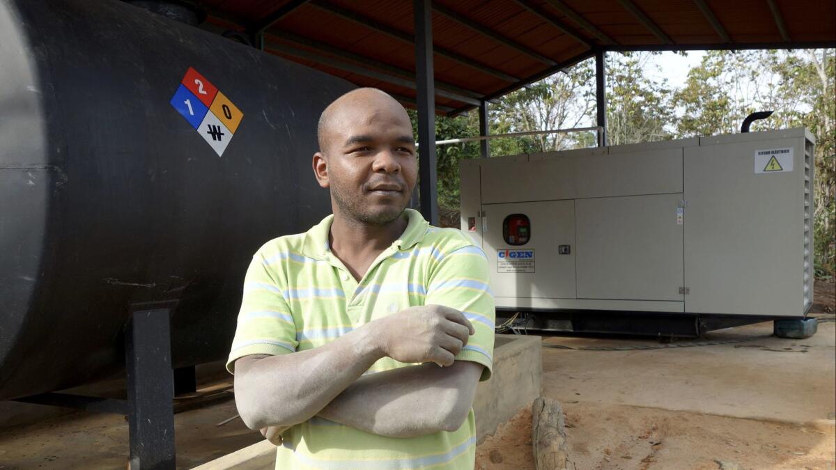 Junior Montanas, 32, who spent half his life with the rebels, mans the camp's 125-kilowatt electric power plant.