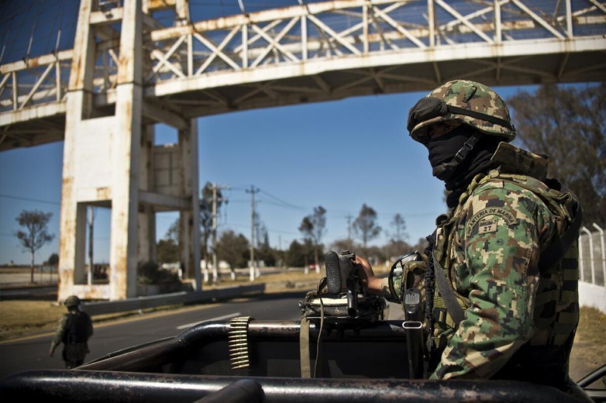Members of the Mexican navy patrol a highway in the state of Mexico, near the capital, Toluca. According to local authorities, 3,000 members of the navy, army, federal police and state police have been deployed since Jan. 24 for the anti-crime Operation Shield.