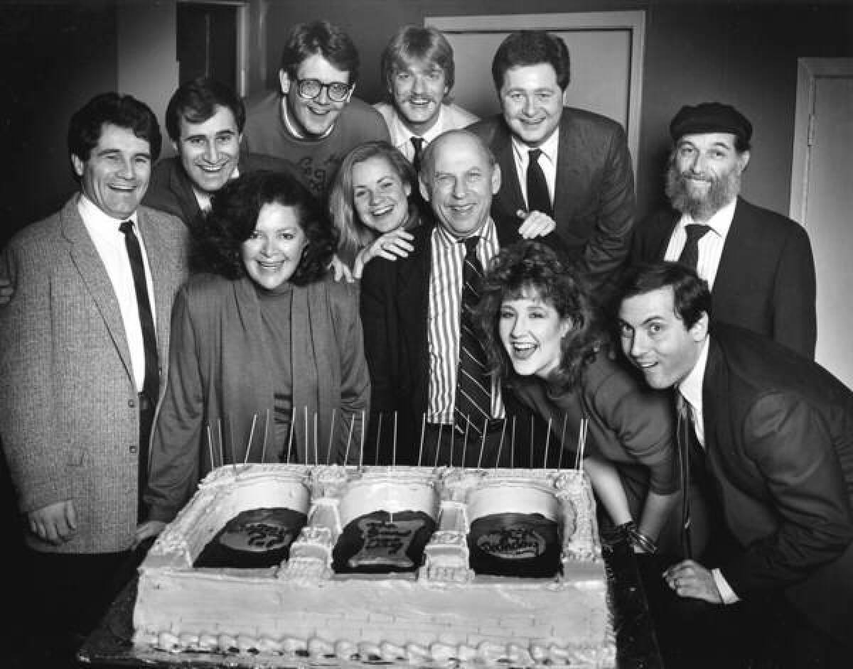 Bernard Sahlins, in striped shirt in front row, co-founder of Second City, poses in 1986 with a number of comics who performed at the Chicago venue.