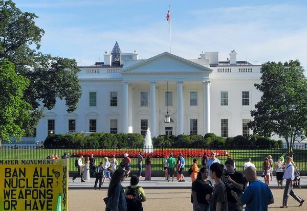 Tourists outside the White House.