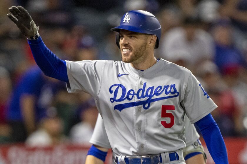 Los Angeles Dodgers' Freddie Freeman reacts to his friends and family in the stands.