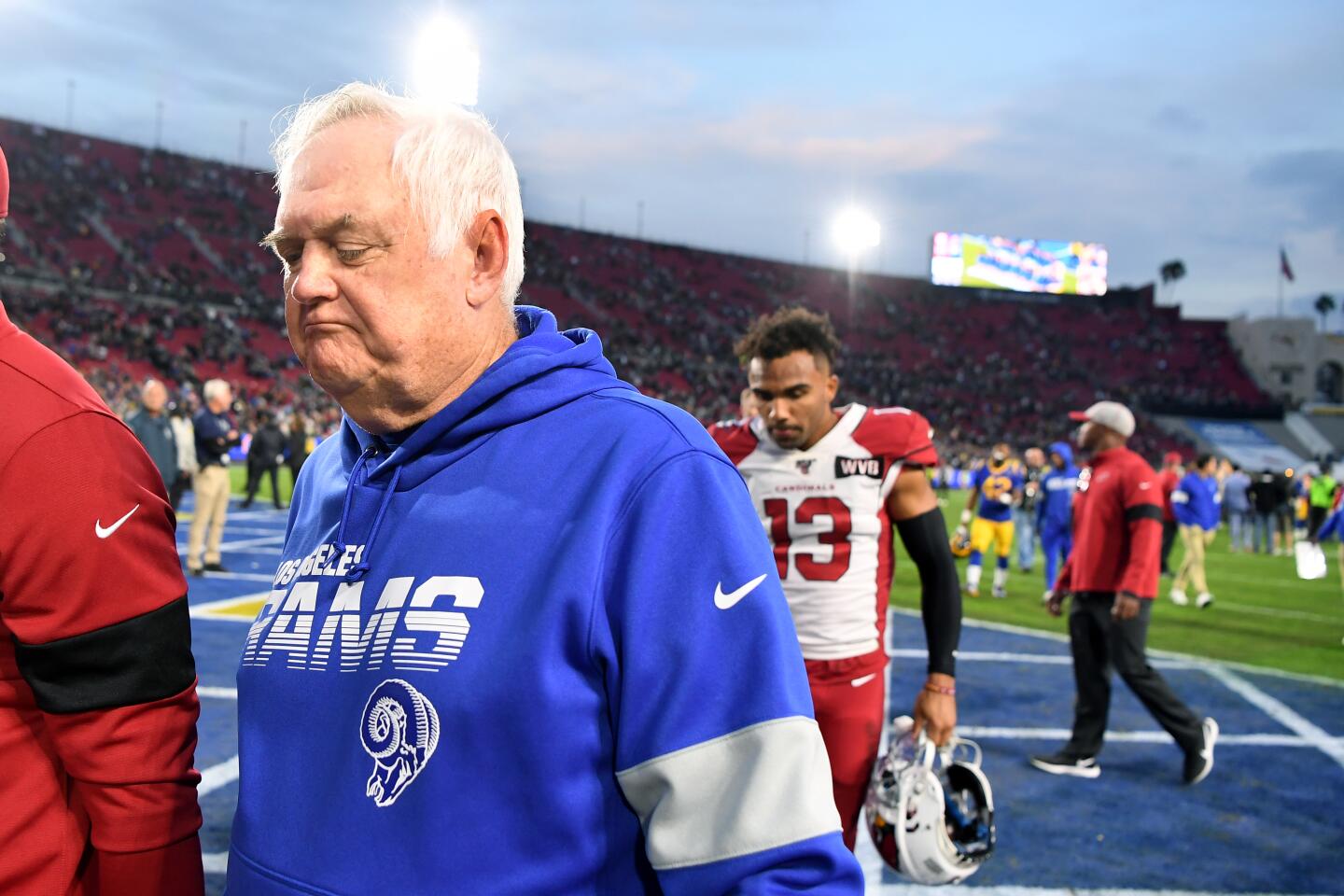 Rams defensive coordinator Wade Phillips walks off the field following a 31-24 victory over the Arizona Cardinals at the Coliseum.