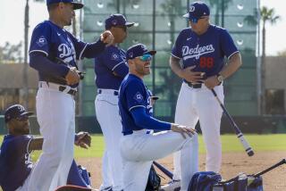  Dodgers first baseman Freddie Freeman, front, looks on with Jason Hayward, Dino Ebel, manager Dave Roberts and Bob Geren.