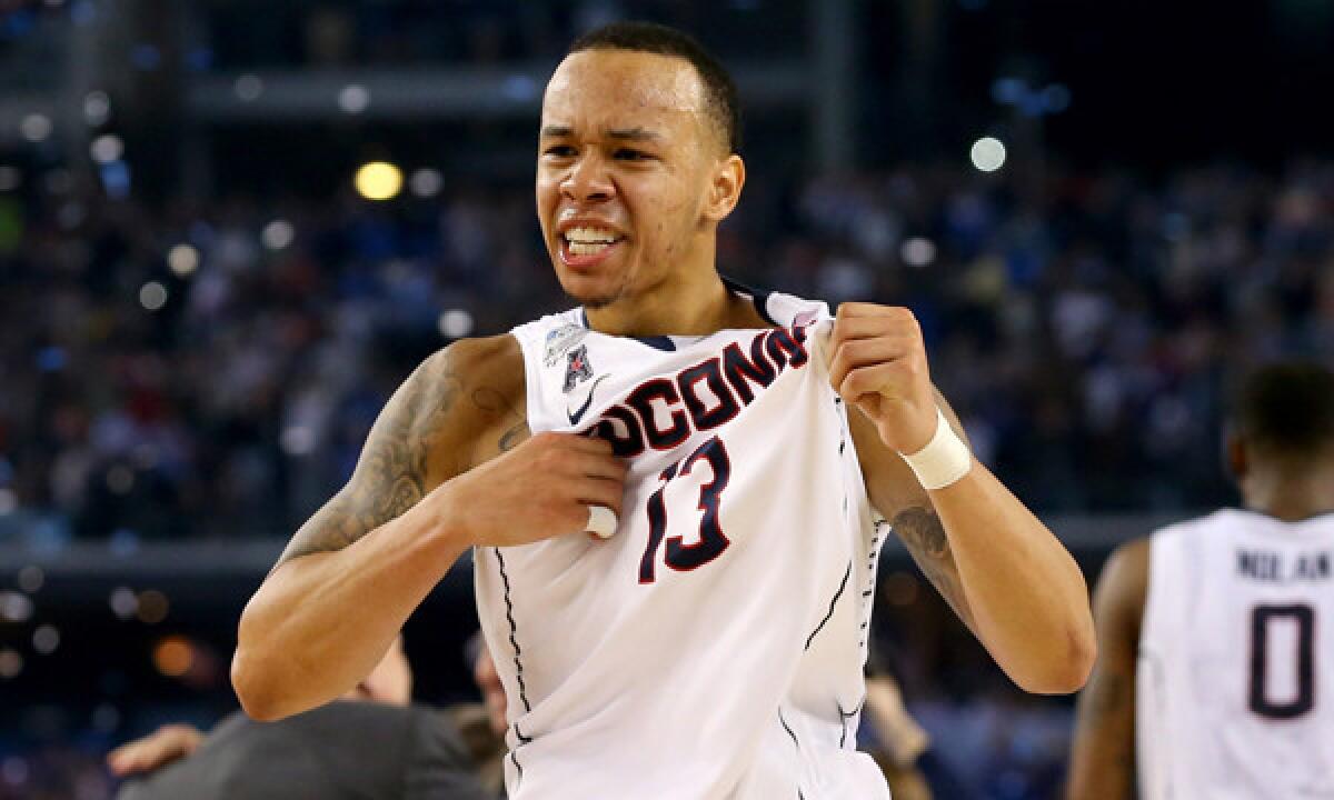Connecticut's Shabazz Napier celebrates the Huskies' 60-54 national title victory over Kentucky on Monday.