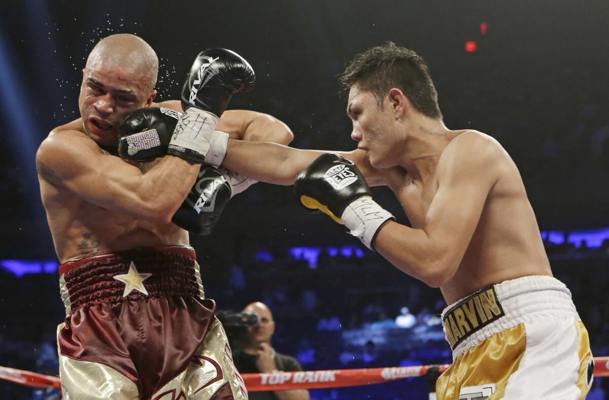 Fighting with fists may have driven the evolution of man's face, a new study suggests. Here, Marvin Sonsona, of the Philippines, punches Wilfredo Vazquez, of Puerto Rico, during the first ninth round of a NABF Featherweight Title boxing match Saturday, June 7, 2014, in New York. Sonsoma won the fight by split decision.