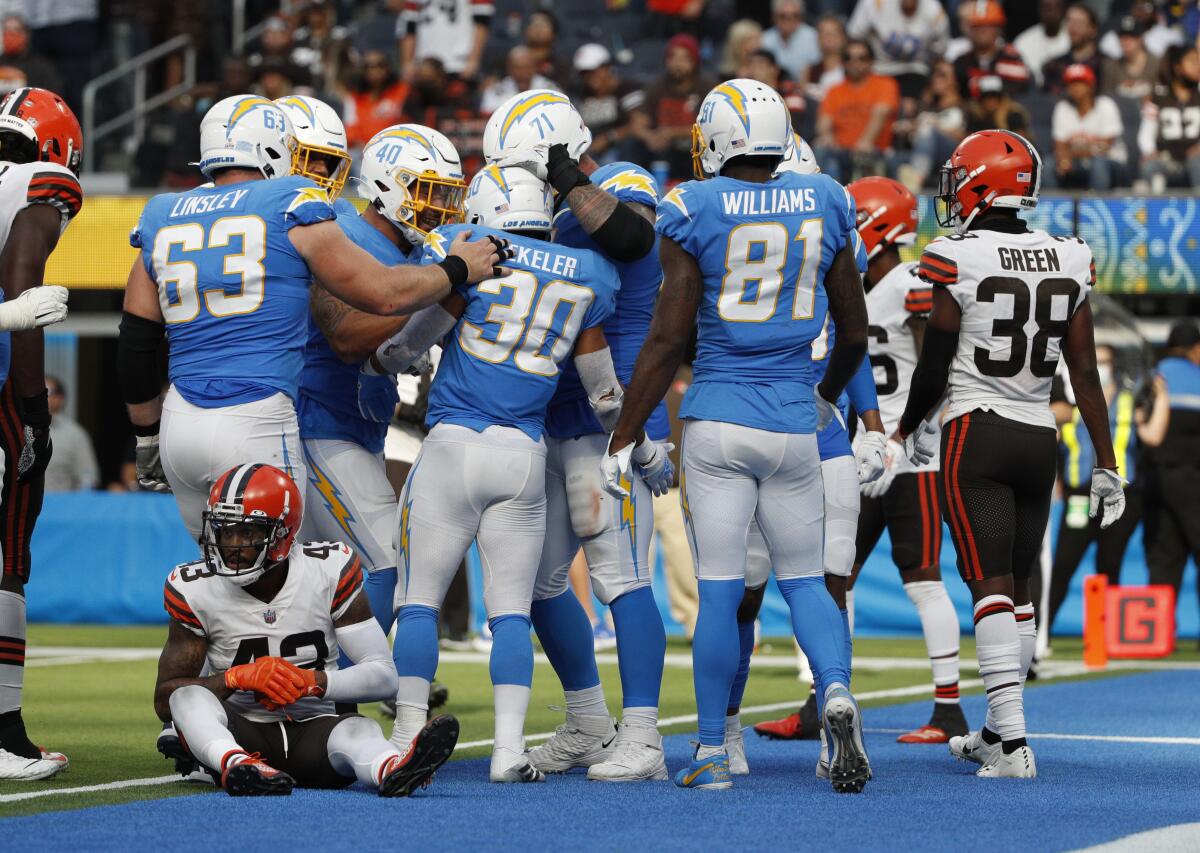 The Chargers celebrate following a touchdown run by Austin Ekeler in the fourth quarter.