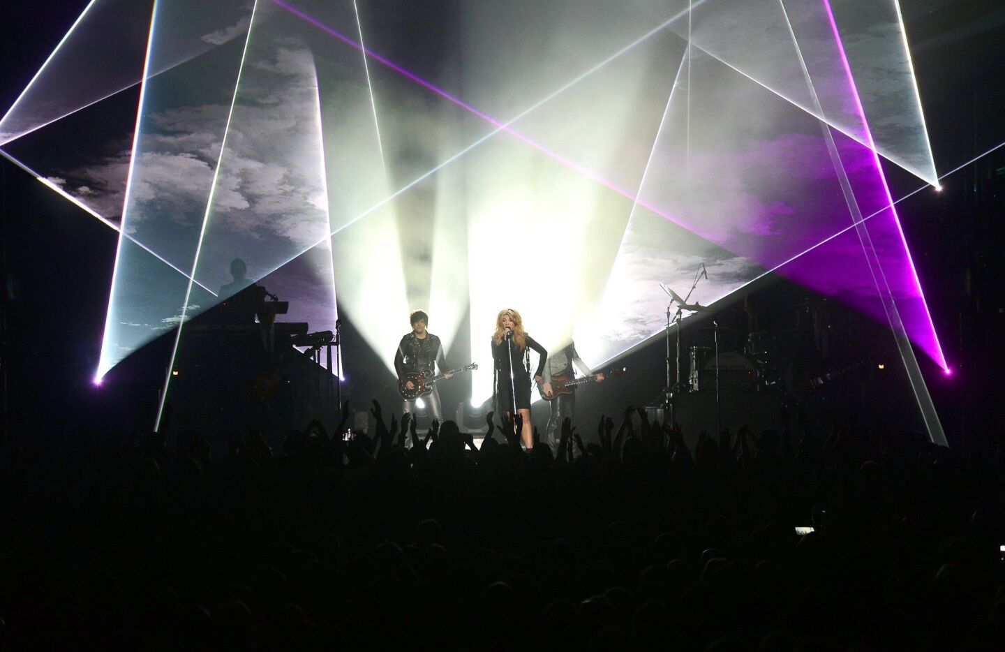 Singers Neil Perry, left, Kimberly Perry and Reid Perry of the Band Perry perform onstage during the 2013 Billboard Music Awards.