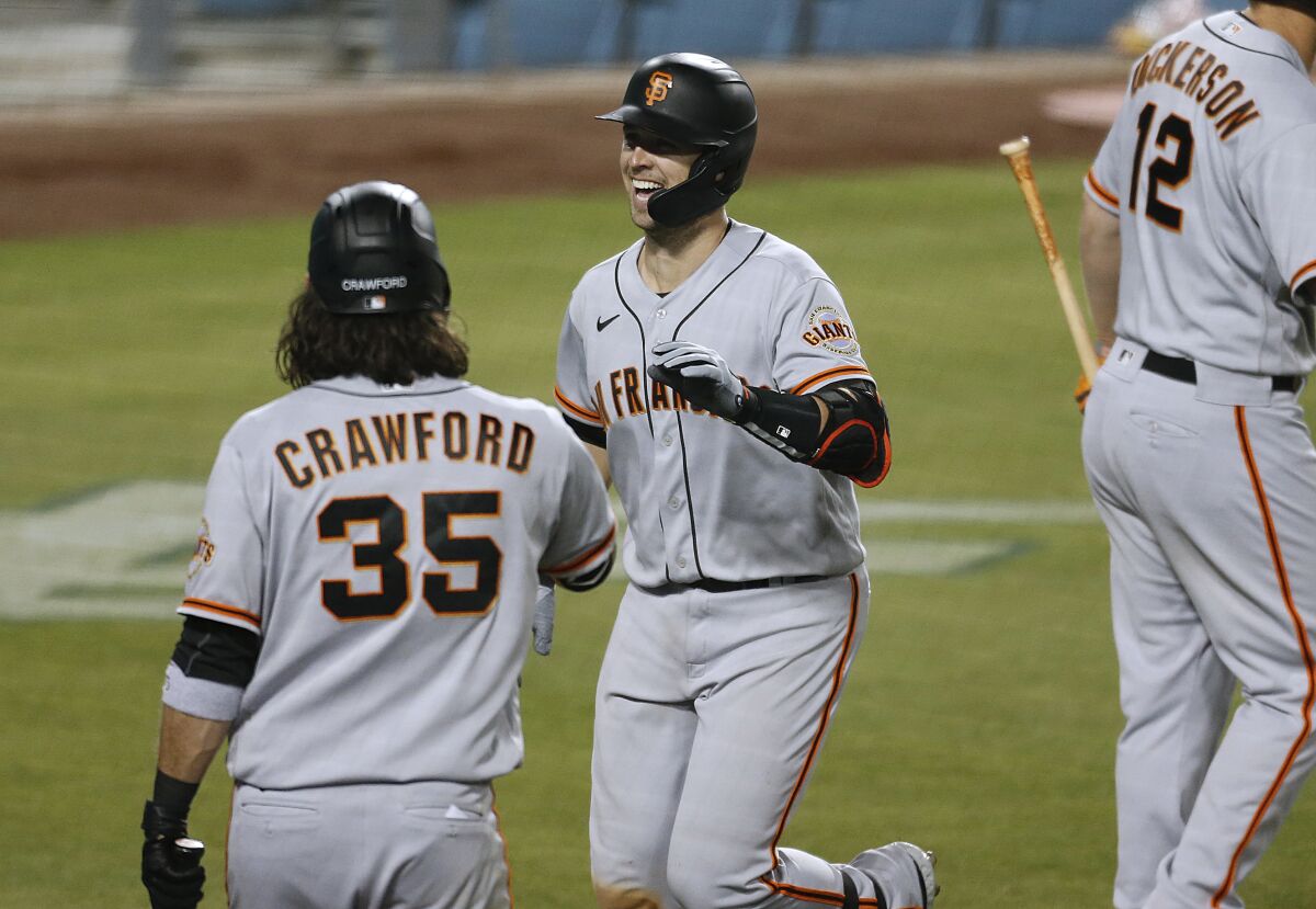 San Francisco Giants players Buster Posey and Brandon Crawford at Dodger Stadium in May. 