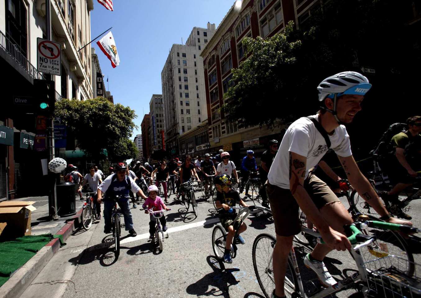 Riders make their way west on 7th Street in downtown Los Angeles during the 4th Annual CicLAvia on April 15, 2012. Inspired by Ciclovia, the original weekly street closure event in Bogata, Columbia, CicLAvia opens LA streets to bicyclists and pedestrians, creating a temporary web of public space.