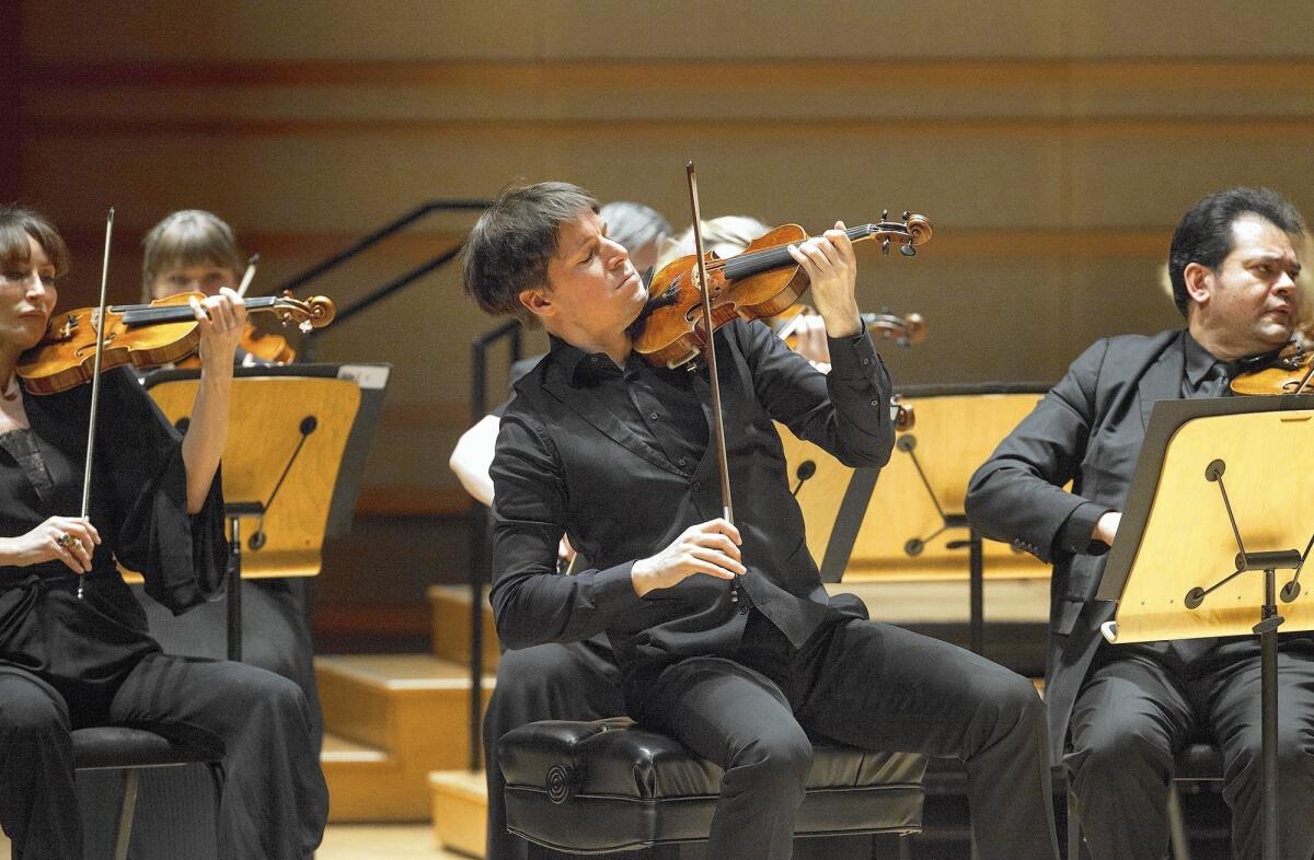 Violinist and conductor Joshua Bell performs Prokofiev's Symphony No. 1 during the Academy of St. Martin in the Fields concert at the Renee and Henry Segerstrom Concert Hall in Costa Mesa on Monday.