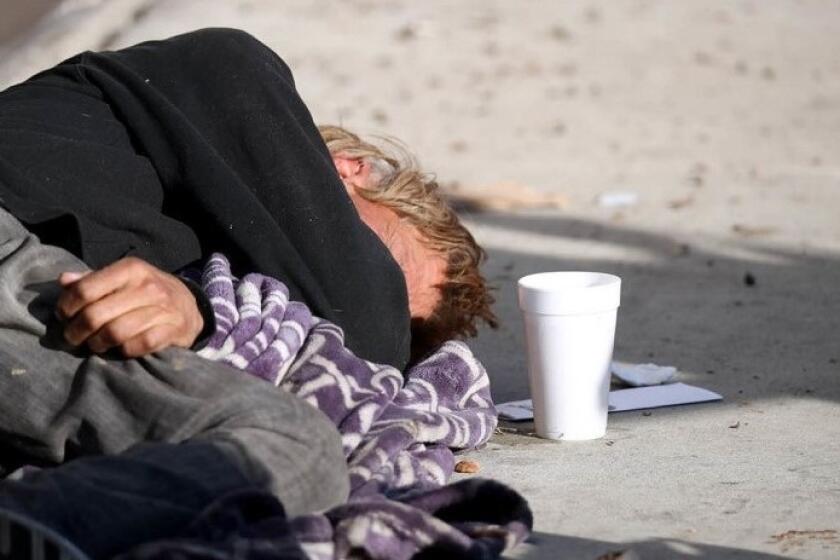 A picture of a homeless man sleeping in the 1800 block of Placentia Avenue in Costa Mesa during January 2019.